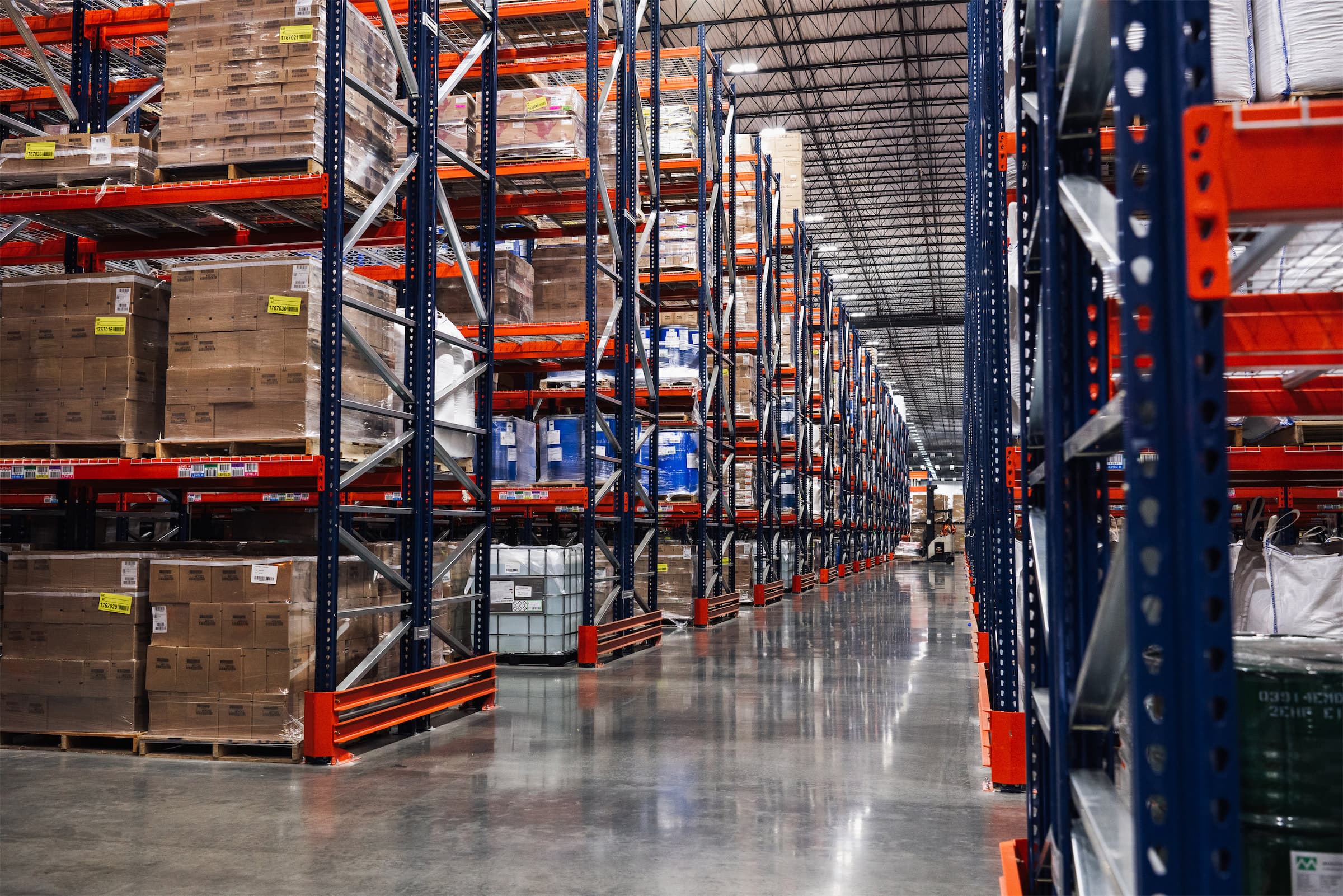 Aisles of tall pallet stacks at a Commonwealth facility
